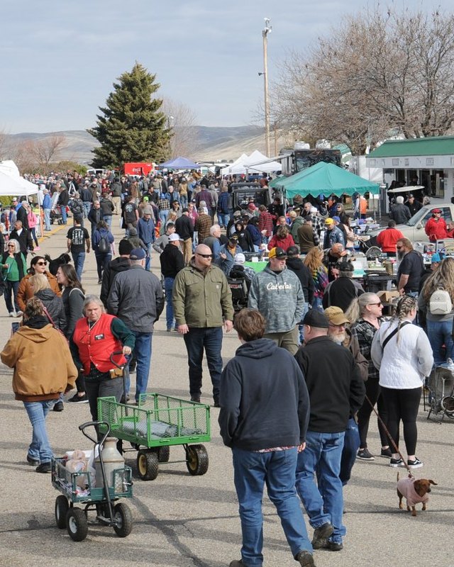 Crowd of shoppers browsing outdoor vendor booths at the Firebird Raceway swap meet