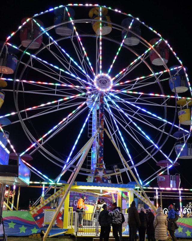 Lit Ferris wheel on the Maryland Holiday Light Spectacular trail at night