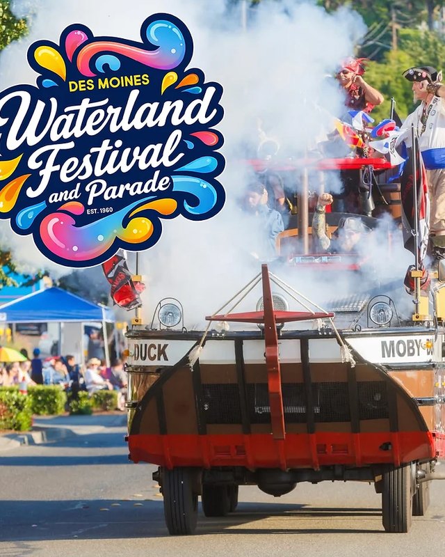 Waterland Festival parade float with performers spraying smoke, with the festival logo overlaid.