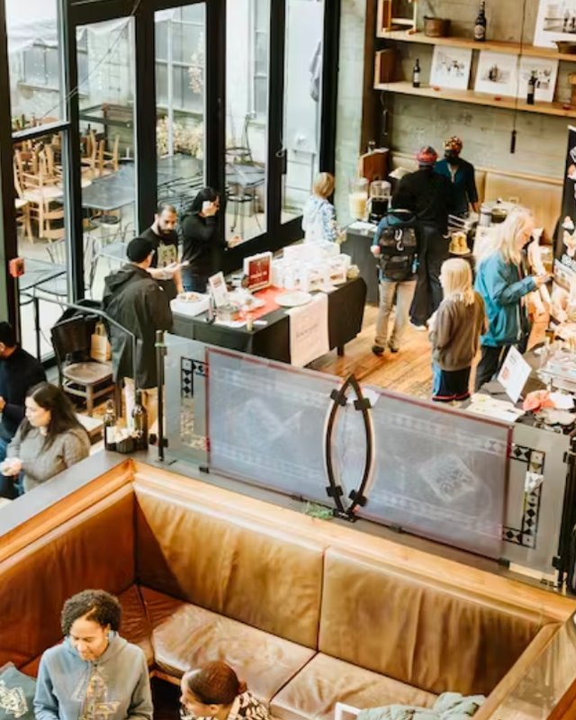 Shoppers and vendor booths crowding the Osteria La Spiga dining room during a past Future of Diversity Holiday Market.