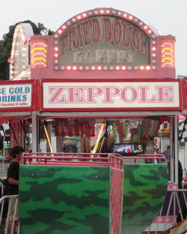 Zeppole food booth with a Fried Dough sign and Ice Gold Drinks sign at the Holbrook Carnival & Craft Fair.