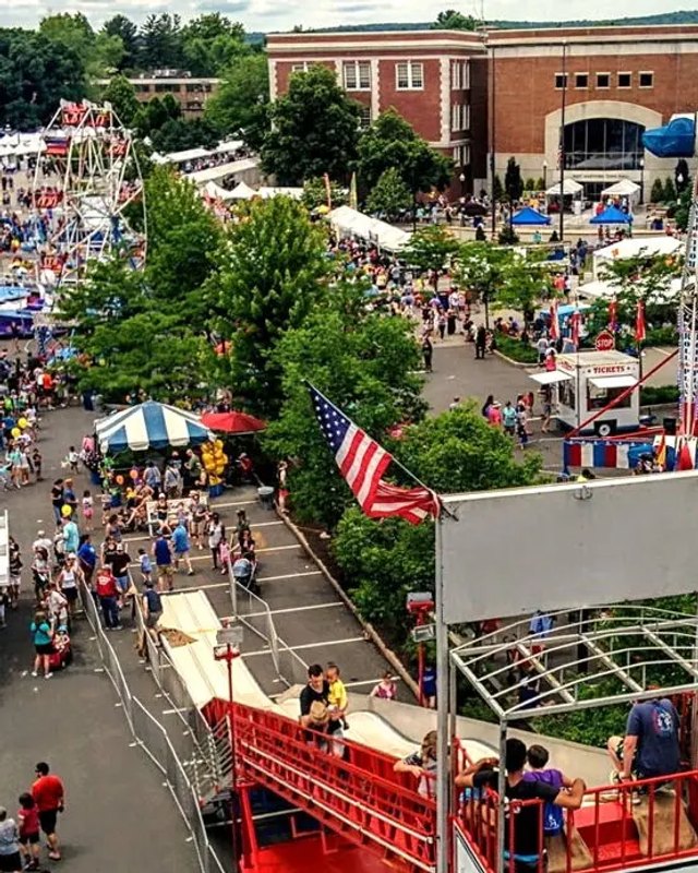 Aerial view of crowds and white tents at the Celebrate West Hartford street festival.
