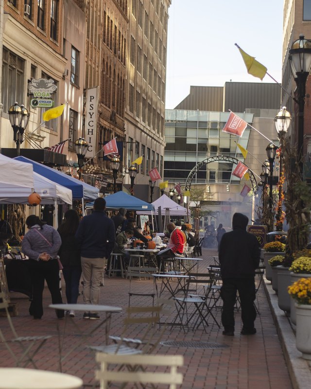 Shoppers and vendor tents lining a downtown Hartford plaza street during the Bizarre Bazaar