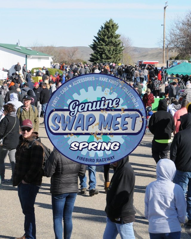 Large crowd of shoppers walking among swap meet vendor tents at the Firebird Raceway spring event.
